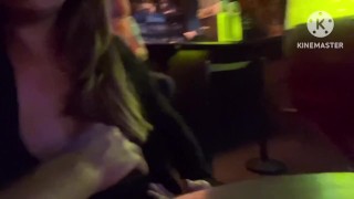 Showing her beautiful breasts in a pub
